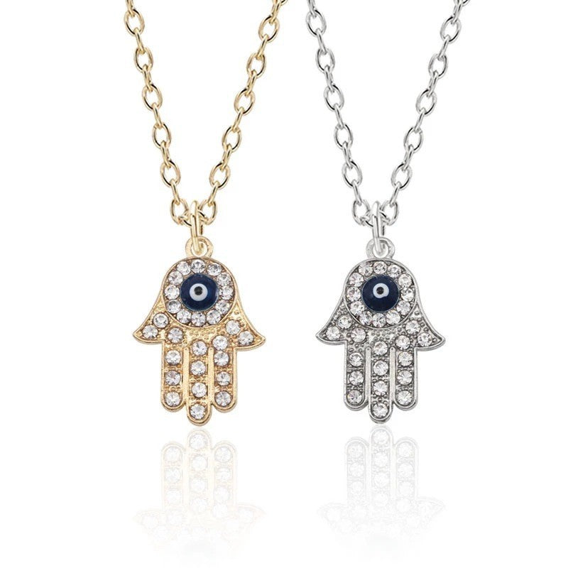 Gold-plated hand chain with rhinestone accents - vintage-inspired pendant featuring an eye and palm design - wholesale from manufacturer