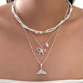 Wholesale diamond-studded mermaid tail bow pendant necklace - european & american cross-border, light luxury, high-end style - women's layering necklace with faux pearl accents