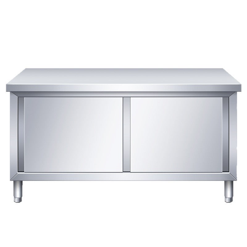 Commercial kitchen workstation: stainless steel countertop with sliding door, cutting board storage, and prep table for restaurants