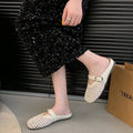 Trendy and versatile closed-toe mules, perfect for wearing out. new 2025 summer collection of breathable, hollow-out flat sandals and slippers for women, available wholesale