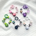 Trendy phone case charm with bell pendant - creative color block, cartoon cute, girly style
