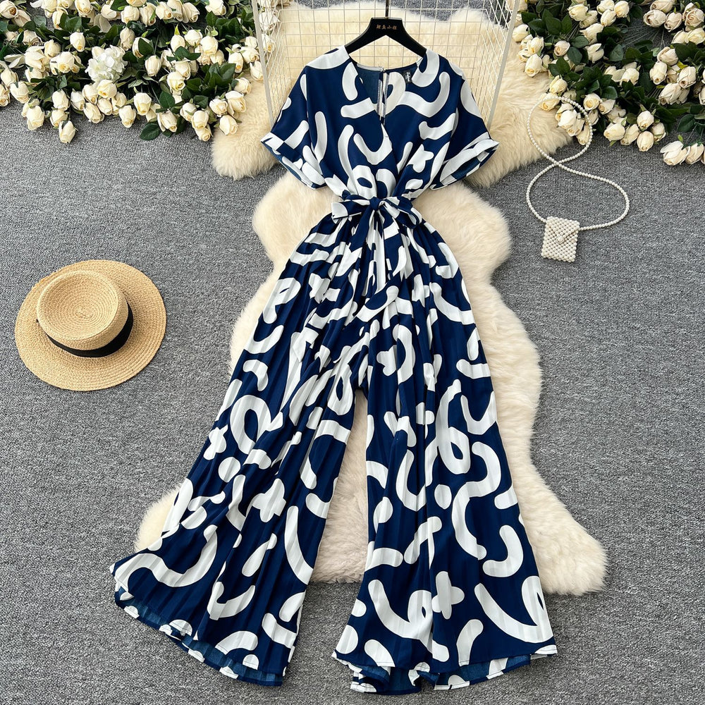 Fashion ins style vacation beach pants women's new style light mature niche stylev neck short sleeve strap looseprinting jumpsuit