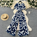 Fashion ins style vacation beach pants women's new style light mature niche stylev neck short sleeve strap looseprinting jumpsuit
