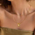 Amazon bestseller: premium bubble 26-letter gold pearlized necklace pendant - stylish women's accessory