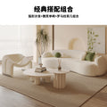 Curved, uniquely shaped, cream-toned sofa – a creative and sophisticated addition to clothing stores, beauty salons, office break rooms, and reception areas