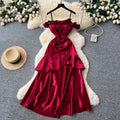French red camisole dress with padded bust, satin, cinched waist, ruffle trim, sleeveless a-line, elegant party dress