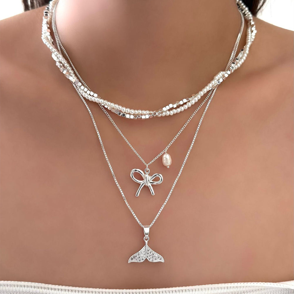 Wholesale diamond-studded mermaid tail bow pendant necklace - european & american cross-border, light luxury, high-end style - women's layering necklace with faux pearl accents