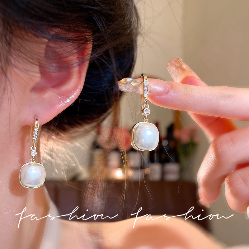 Korean retro pearl pendant earrings women's ins trendy light luxury super sparkling micro-inlaid zircon ear hooks earrings wholesale