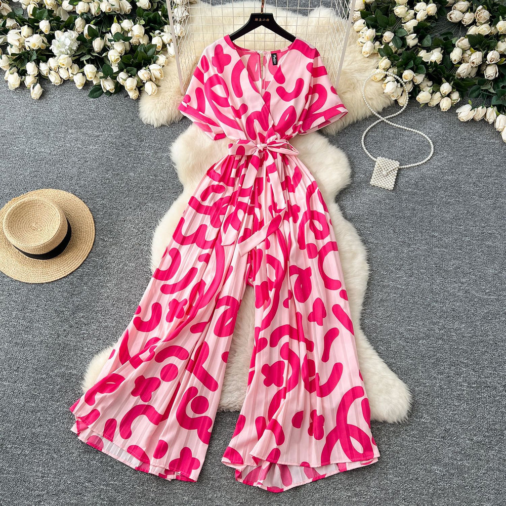 Fashion ins style vacation beach pants women's new style light mature niche stylev neck short sleeve strap looseprinting jumpsuit