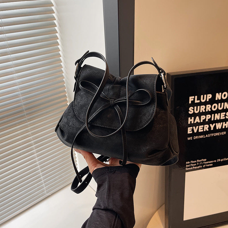 Solid color versatile bow small square bag women's bag 2025 new fashion simple shoulder bag foreign style portable commuter bag