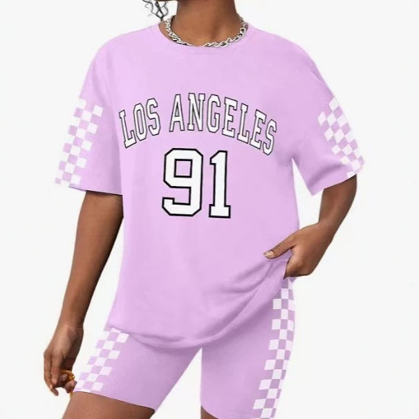 Girls' t-shirt and shorts set featuring a cartoon short-sleeve design and printed graphics, perfect for casual streetwear