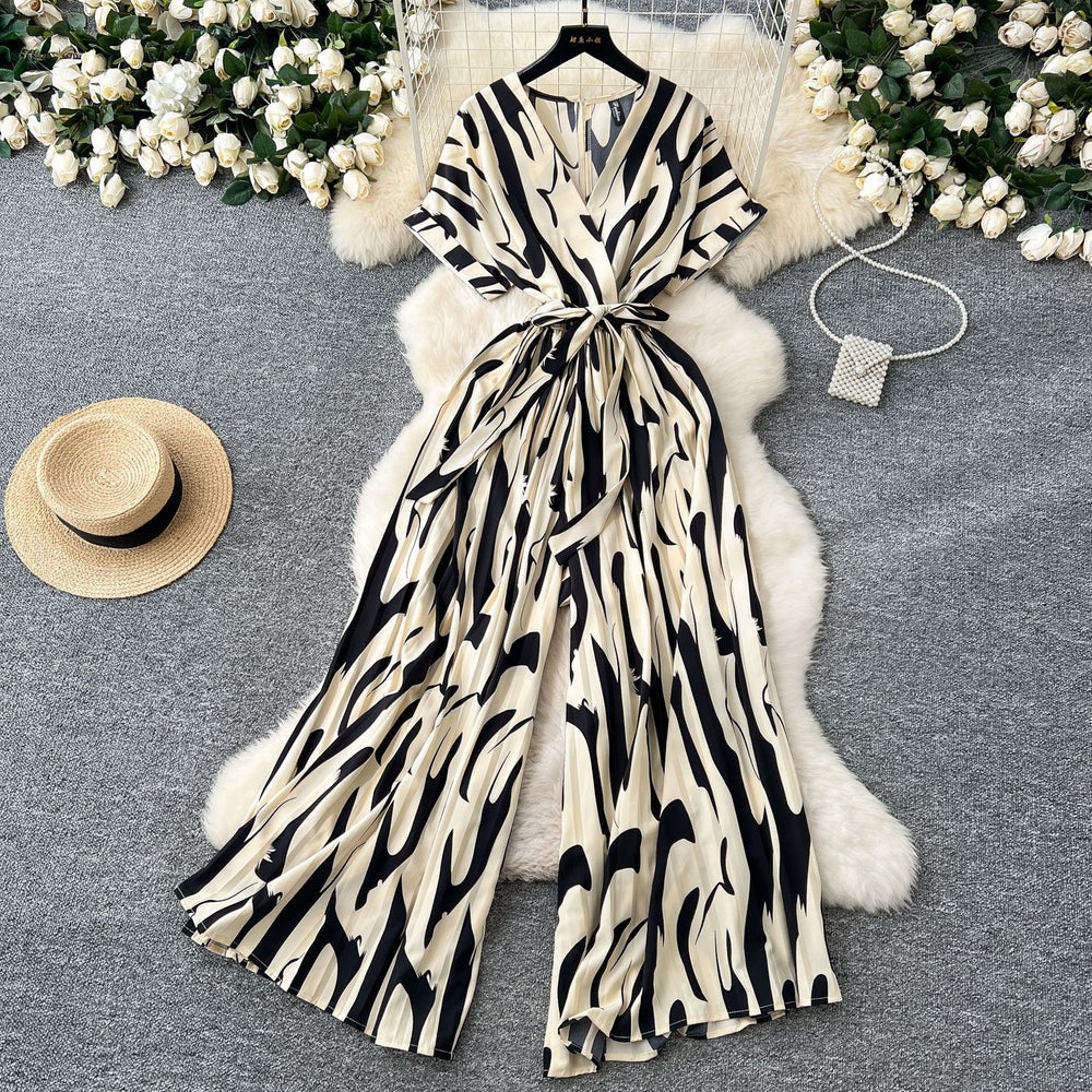 Fashion ins style vacation beach pants women's new style light mature niche stylev neck short sleeve strap looseprinting jumpsuit