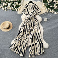 Fashion ins style vacation beach pants women's new style light mature niche stylev neck short sleeve strap looseprinting jumpsuit