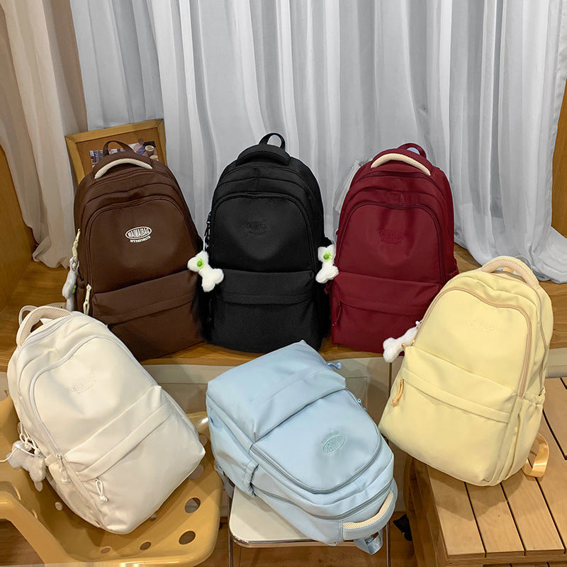 New schoolbag large capacity water-resistant embroidered backpack for junior and senior high school students - solid color, simple, and cute design