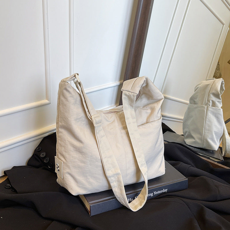 Foreign single nylon cloth bag women's large capacity 2025 new summer leisure niche shoulder messenger bag commuter dumpling bag