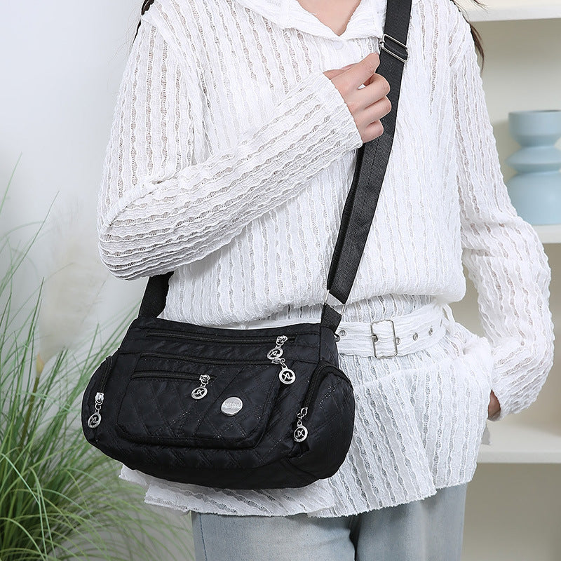 Outdoor casual versatile messenger bag women's large-capacity rhombus embroidery thread simple shoulder bag three-layer storage middle-aged women's bag