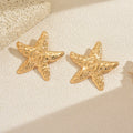 Wholesale seaside earrings: cross-border summer ocean resort style alloy starfish earrings for women - european and american niche exaggerated dangle earrings