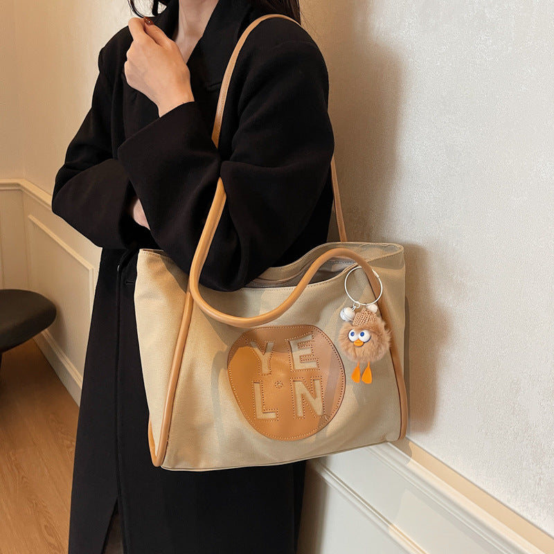 Canvas large capacity letter tote bag women's bag 2025 new casual simple handbag commuter versatile shoulder bag