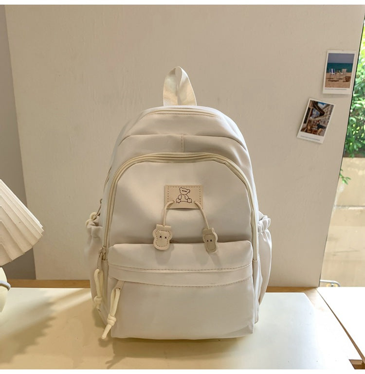 School bag female college student Korean version ins solid color simple and versatile junior high school student travel small backpack high school student backpack
