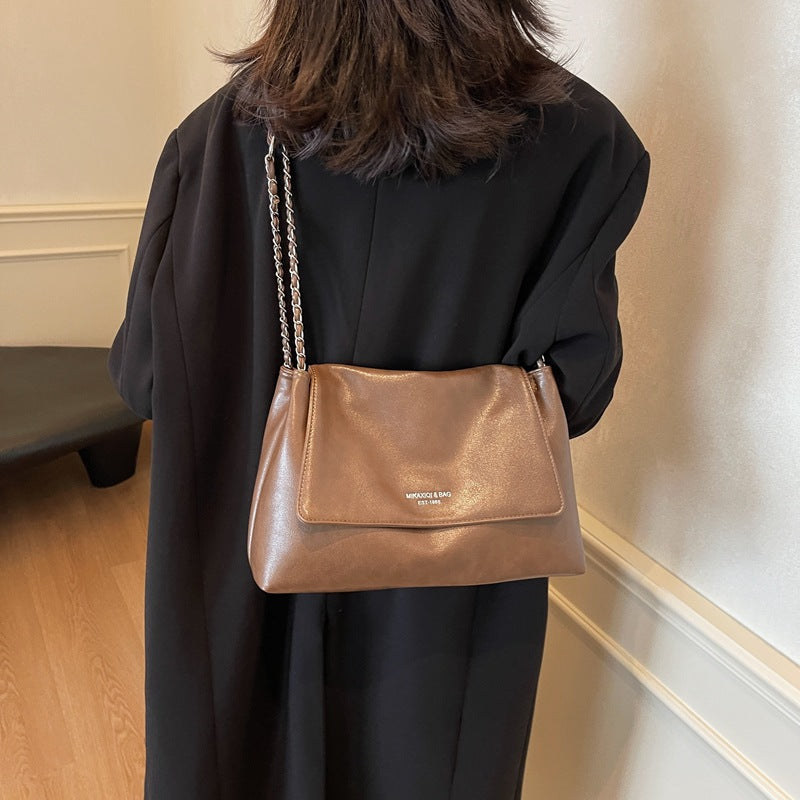 Solid color simple large-capacity foreign gas bag women's 2025 new trendy underarm commuter chain single shoulder tote bag