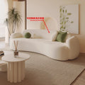 Curved, uniquely shaped, cream-toned sofa – a creative and sophisticated addition to clothing stores, beauty salons, office break rooms, and reception areas