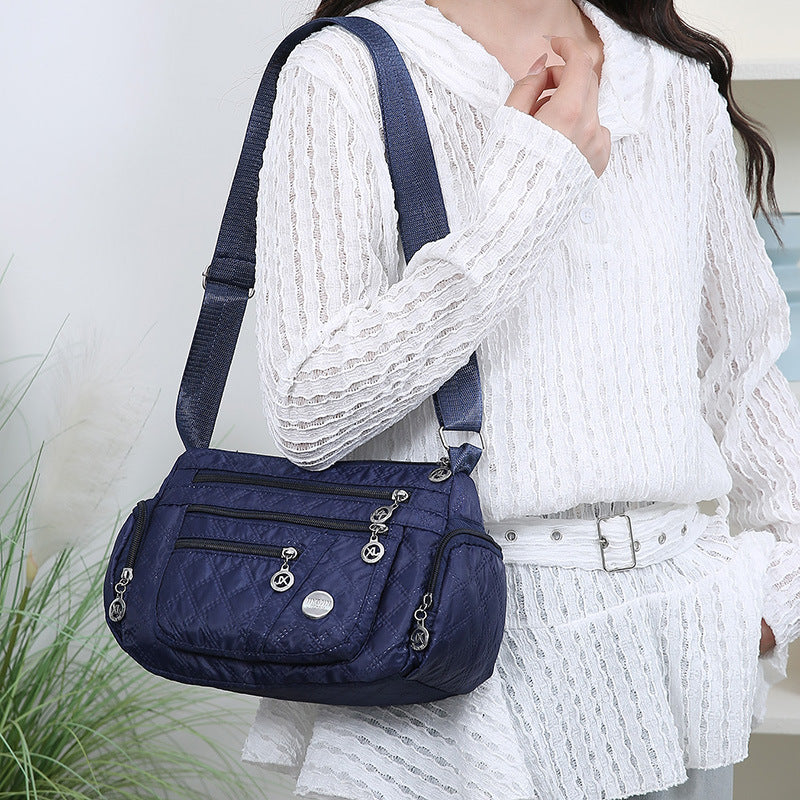 Outdoor casual versatile messenger bag women's large-capacity rhombus embroidery thread simple shoulder bag three-layer storage middle-aged women's bag