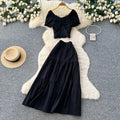Korean-inspired, stylish and chic women's two-piece set featuring a puff-sleeve, square-neck top and a high-waisted, figure-flattering midi skirt