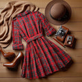 Vintage plaid shirt dress with turn-down collar, belted waist, a-line skirt, and roll-up cuffs