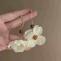 Vacation style white flower earrings for women niche stylesense of designstylish exaggerated earrings for big round face modification earrings trendy