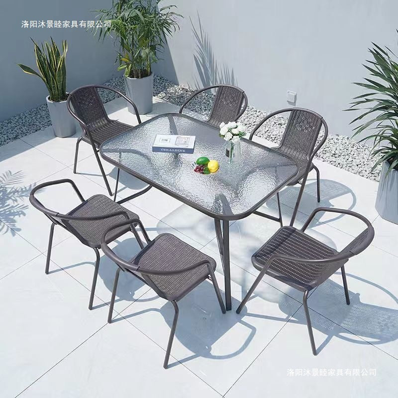 Outdoor table and chair set with umbrella, sunshade, perfect for outdoor cafes, bubble tea shops, and casual outdoor seating. features a wrought iron frame and rattan chairs, ideal for patios and gardens