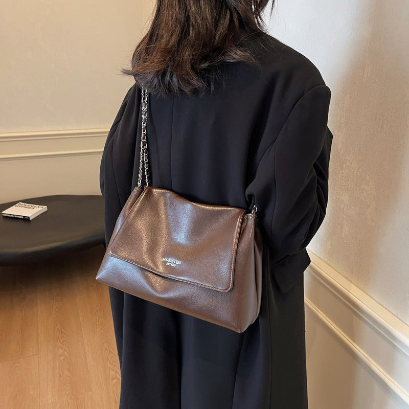 Solid color simple large-capacity foreign gas bag women's 2025 new trendy underarm commuter chain single shoulder tote bag
