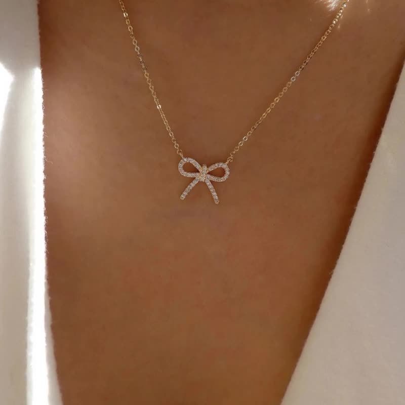 Customized necklaces: european and american cross-border jewelry, minimalist fashion bow pendant, women's zinc alloy diamond-studded necklace