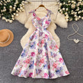 High-end floral print sleeveless dress for women, perfect for summer. elegant, high-waisted, and figure-flattering a-line silhouette, ideal for a sophisticated vacation look