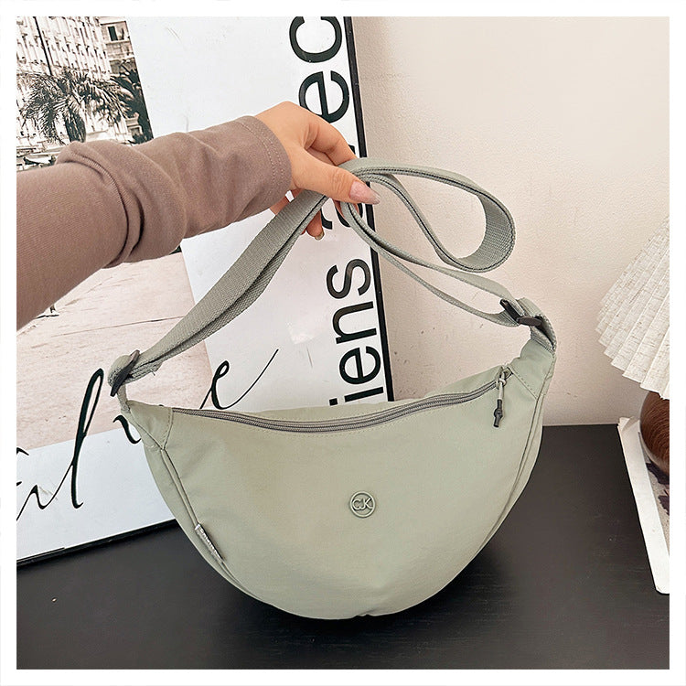 Spring casual macaron color dumpling bag 2026 new versatile crossbody bag women's korean style commuter shoulder bag