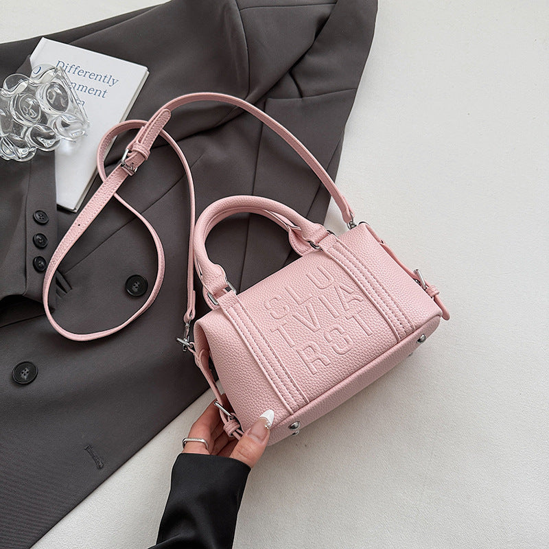 Fashion niche high-end sense embossed letter pillow bag 2025 new summer versatile color casual messenger bag