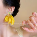 Vacation-style yellow floral fabric earrings for women, beachy colorful face-framing small earrings, statement earrings, unique and eye-catching ear accessories