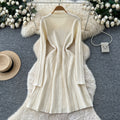 French chic, high-end, luxurious knitted dress with heavily embellished metal buckle – perfect for autumn/winter, featuring a cinched waist and ideal as a layering piece