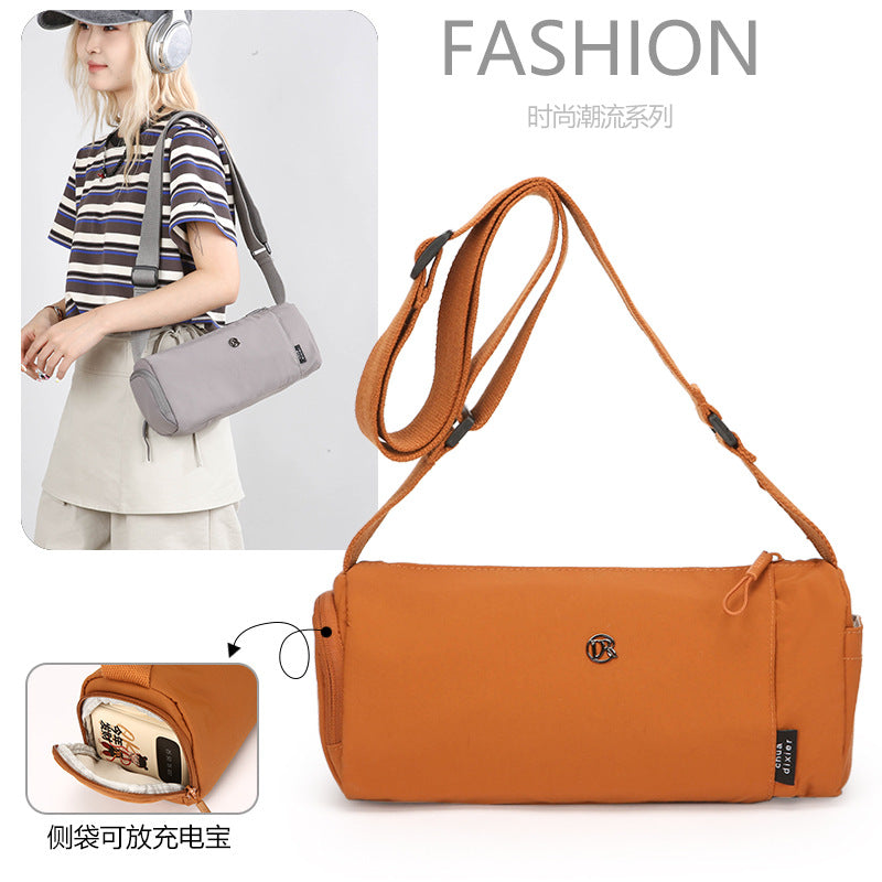 Simple Japanese shoulder bag women's nylon anti-splashing cylinder pillow bag trendy cool messenger bag commuter portable handbag