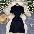 Elegant semi-high neck short sleeve dress - women's designer knit midi dress with button detail, cinched waist, and slit hem for a slimming silhouette