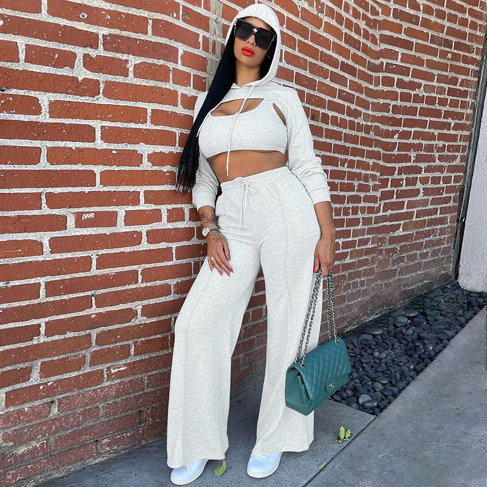 S391419 Cross-border explosive wholesale European and American casual hooded hollow sweater solid color suspender trousers three-piece set women