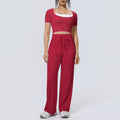 Fake two-piece sports short-sleeved yoga suit with chest pad, drawstring wide-leg straight-leg pants, quick-drying running fitness suit