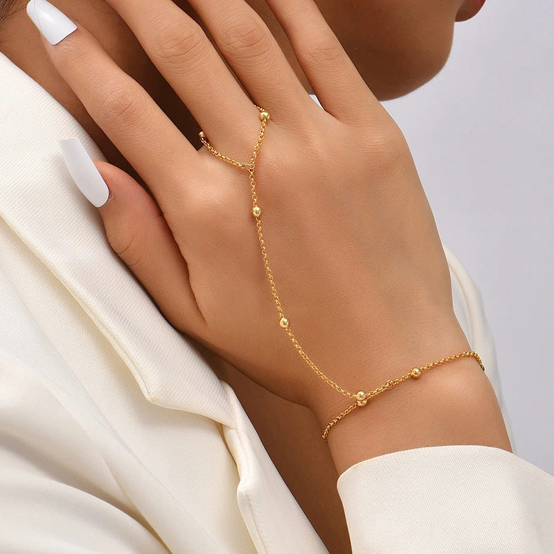 European and american new arrival versatile jewelry: minimalist white pearl bracelet, women's butterfly finger chain bracelet - wholesale from manufacturer