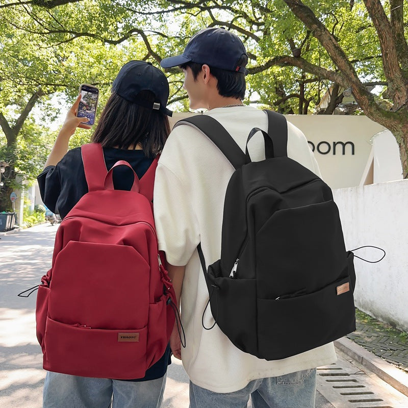 New solid color junior high school student large-capacity backpack male backpack schoolbag male college student business travel backpack
