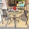 Outdoor table and chair set with umbrella, sunshade, perfect for outdoor cafes, bubble tea shops, and casual outdoor seating. features a wrought iron frame and rattan chairs, ideal for patios and gardens