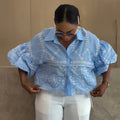 European and american cross-border women's fashion:  summer new arrival - stylish turn-down collar, hollow-out detail, loose fit, bubble sleeve design shirt top