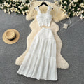 Age-reducing fresh spring and summer holiday style short small flying sleeve suspender tops + high waist pleated skirt two-piece set