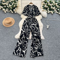 Summer outfit: women's vacation-ready fashion - collared short sleeve tie-waist casual printed wide-leg jumpsuit/pants