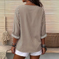 Fashion holiday style vertical pattern blouse, light fabric, half placket, wooden buttons, loose three-quarter sleeves, daily casual lining