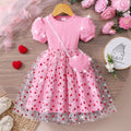 Girls' ribbed knit dress with heart-shaped mesh sleeves and pearl accents, includes crossbody bag
