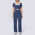 Fake two-piece sports short-sleeved yoga suit with chest pad, drawstring wide-leg straight-leg pants, quick-drying running fitness suit